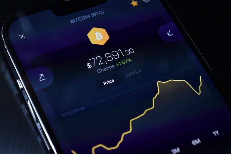 A cell phone displaying bitcoin on the screen